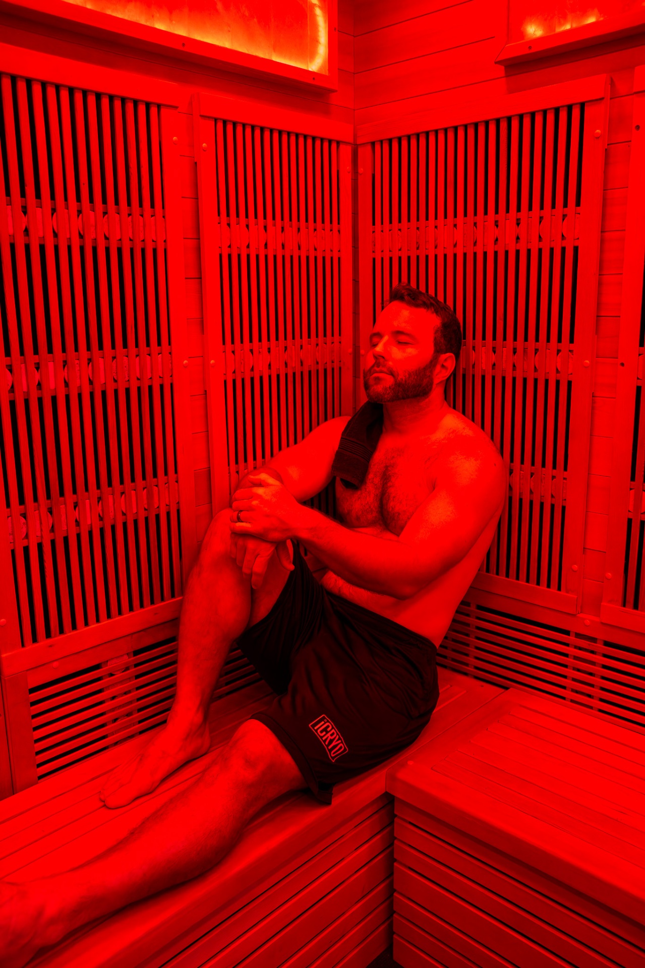 Client relaxing in the iCRYO Highland Village infrared sauna